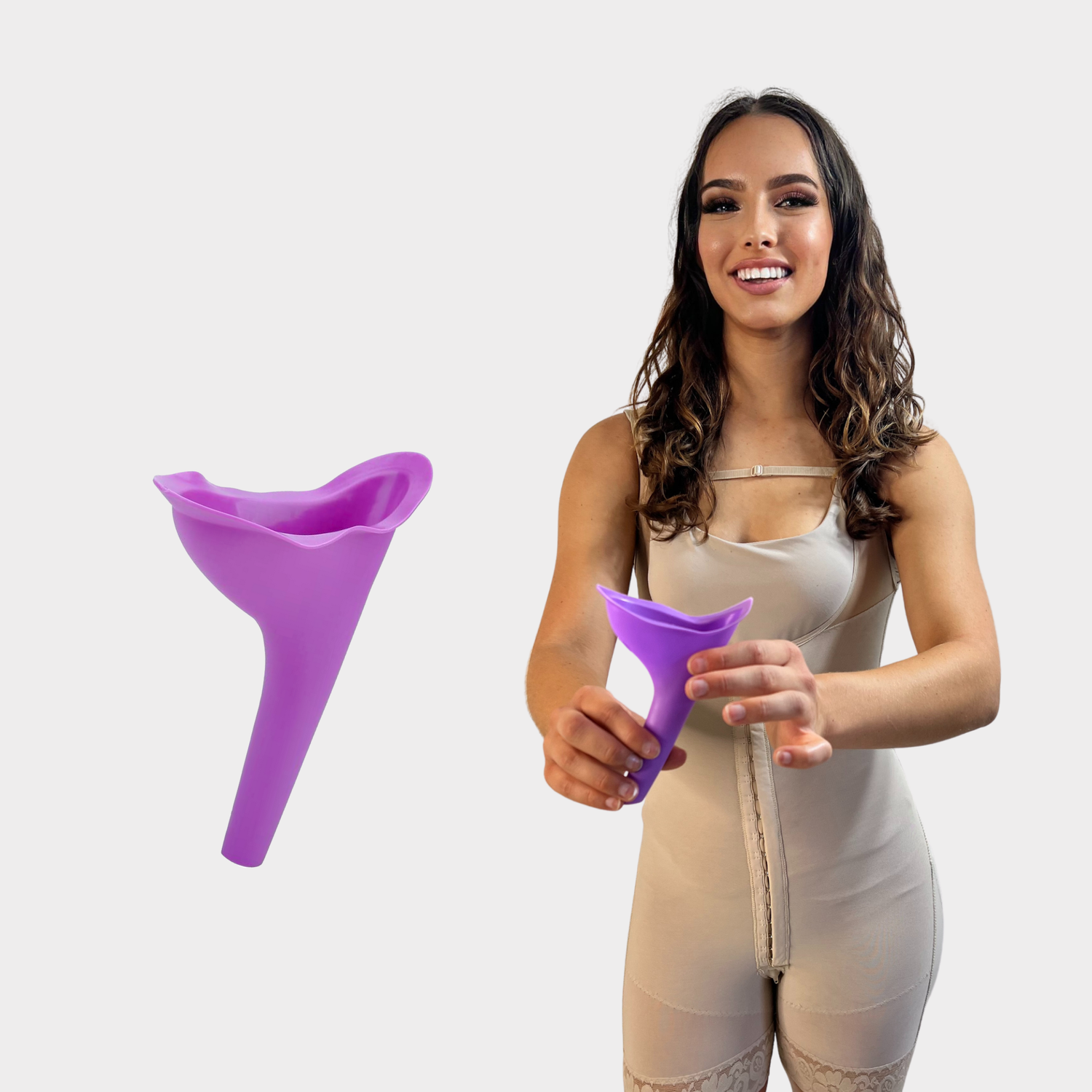 Woman in compression garment holding the urinal device with product inset